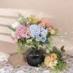 Pastel Bridesmaid Bouquet in Blush, Ivory & Blue styled table view